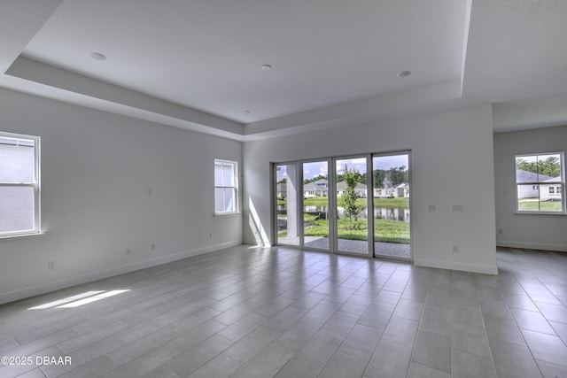 1316 Loftwedge Cir, Daytona Beach, FL 32124 - unfurnished room with a raised ceiling and a water view