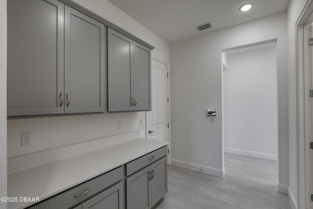 1316 Loftwedge Cir, Daytona Beach, FL 32124 - kitchen featuring gray cabinets, recessed lighting, and light countertops