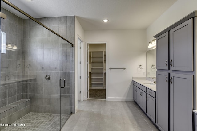 1316 Loftwedge Cir, Daytona Beach, FL 32124 - full bath with vanity, a spacious closet, a shower stall, tile patterned floors, and recessed lighting
