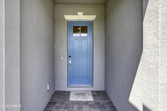 1316 Loftwedge Cir, Daytona Beach, FL 32124 - view of exterior entry featuring stucco siding