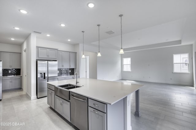 1316 Loftwedge Cir, Daytona Beach, FL 32124 - kitchen featuring stainless steel appliances, gray cabinets, backsplash, and recessed lighting