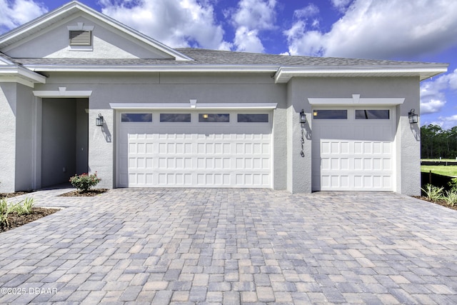 1316 Loftwedge Cir, Daytona Beach, FL 32124 - garage featuring decorative driveway