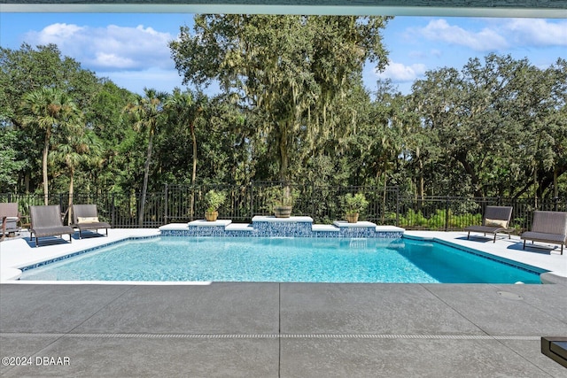 view of swimming pool with a patio