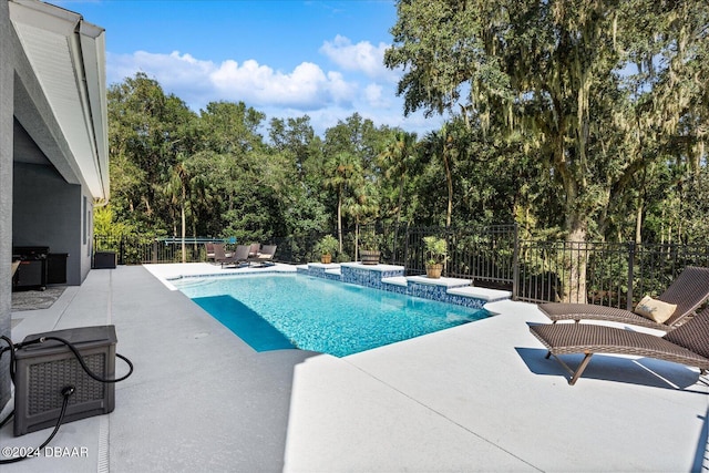 view of swimming pool with a patio area