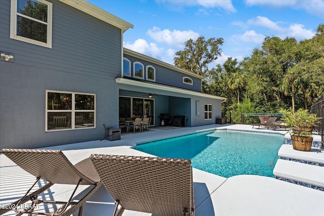 view of pool featuring central AC unit and a patio area