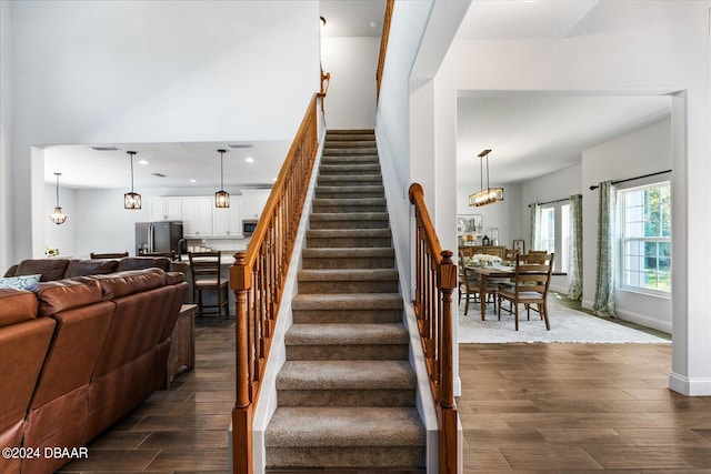 stairway featuring hardwood / wood-style floors