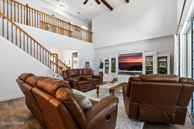 living room with high vaulted ceiling, wood-type flooring, beamed ceiling, and ceiling fan