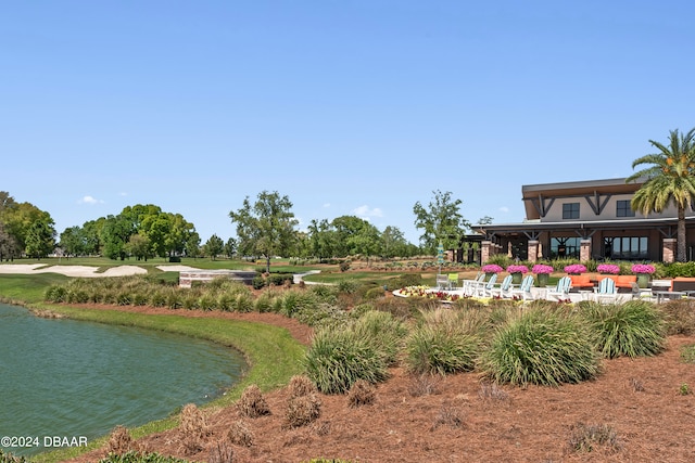 surrounding community featuring a water view