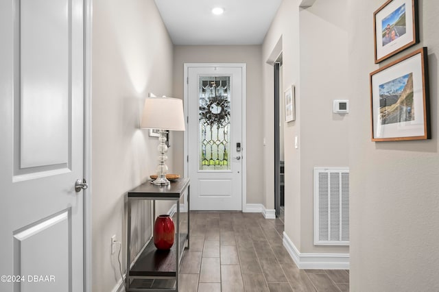 doorway to outside with light hardwood / wood-style floors