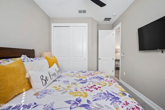 carpeted bedroom featuring ceiling fan and a closet