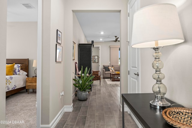 hall with dark hardwood / wood-style floors