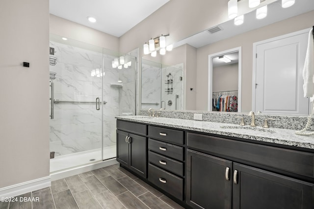 bathroom with vanity and an enclosed shower