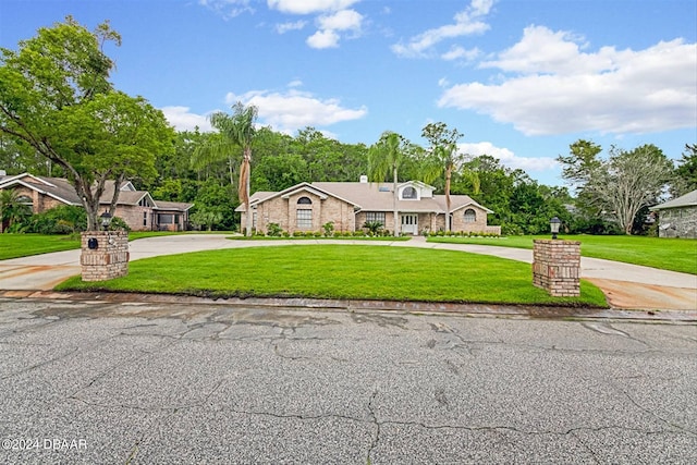 ranch-style house with a front lawn