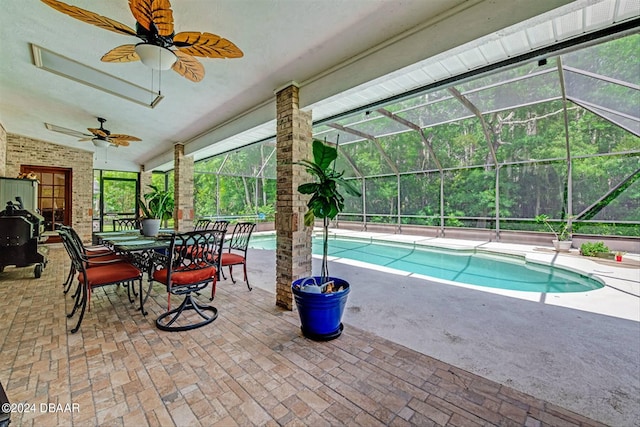 view of pool featuring a lanai, ceiling fan, and a patio area