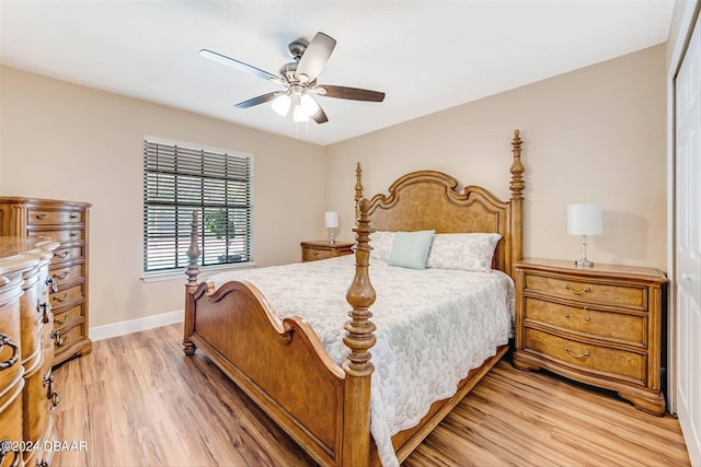 bedroom with ceiling fan, a closet, and light wood-type flooring