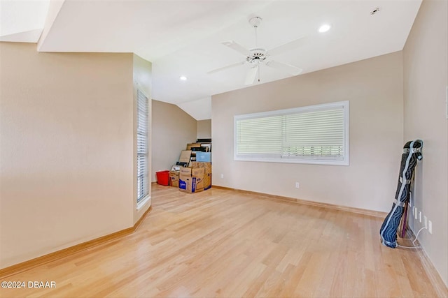 interior space with lofted ceiling, hardwood / wood-style flooring, and ceiling fan