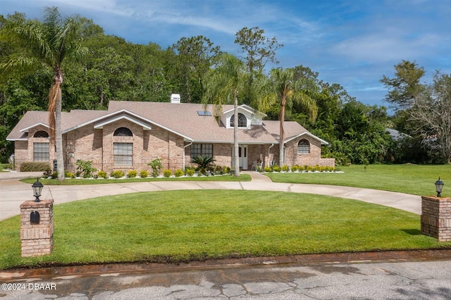 ranch-style house featuring a front lawn