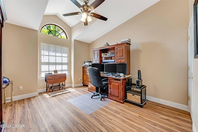 office area featuring light hardwood / wood-style floors, ceiling fan, and high vaulted ceiling