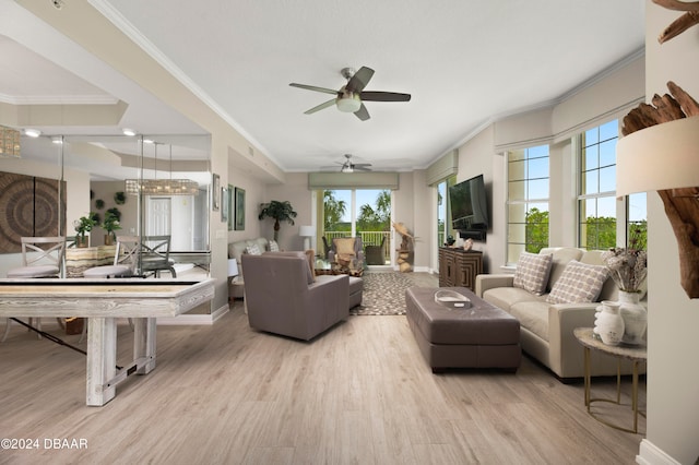 living room featuring ceiling fan, light wood-type flooring, and ornamental molding