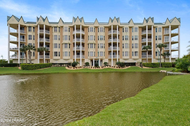 view of building exterior with a water view