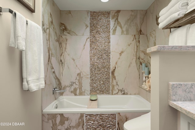 bathroom with a relaxing tiled tub