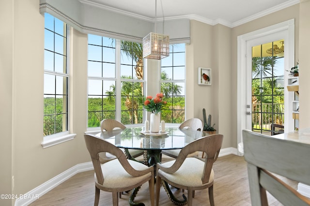 dining area with light wood-type flooring and a healthy amount of sunlight