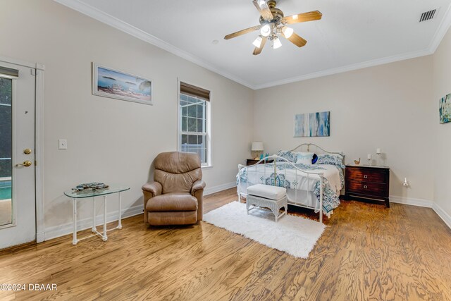 bedroom with ornamental molding, light hardwood / wood-style floors, and ceiling fan