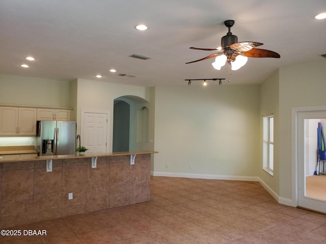 7 Old Mcduffie Cir, Ormond Beach, FL 32174 - kitchen featuring stainless steel refrigerator with ice dispenser, arched walkways, a ceiling fan, recessed lighting, and light tile patterned floors