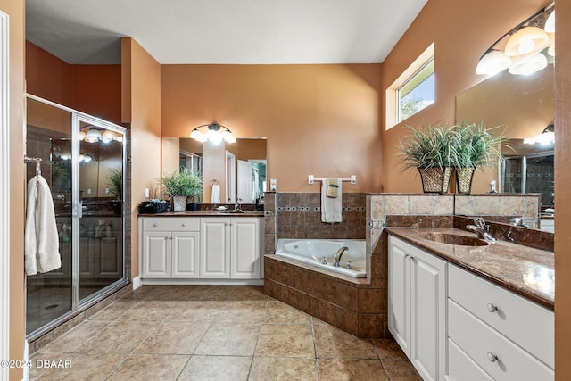 bathroom with vanity and separate shower and tub