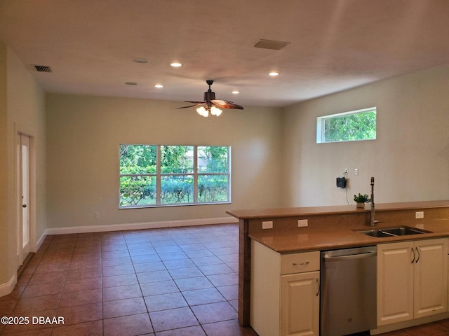 7 Old Mcduffie Cir, Ormond Beach, FL 32174 - kitchen with dishwasher, a sink, white cabinetry, a ceiling fan, and recessed lighting