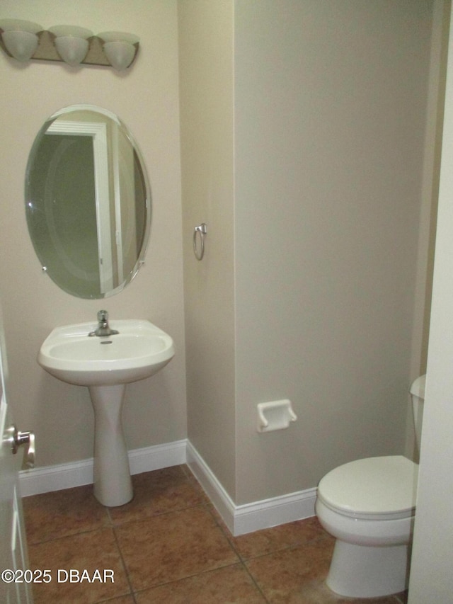 7 Old Mcduffie Cir, Ormond Beach, FL 32174 - bathroom with toilet, baseboards, and tile patterned flooring