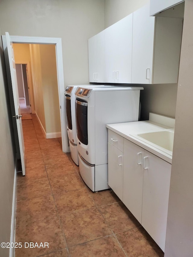 7 Old Mcduffie Cir, Ormond Beach, FL 32174 - laundry room featuring cabinet space, washing machine and dryer, baseboards, and light tile patterned floors