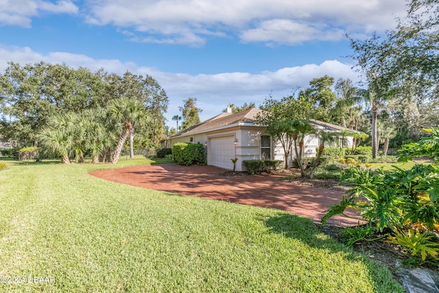 view of yard with a garage