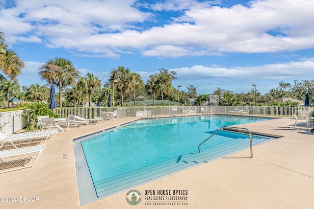 view of swimming pool featuring a patio area