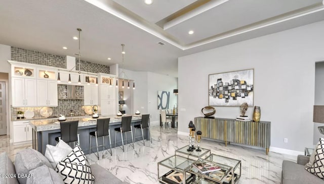 497 Stirling Bridge Dr, Ormond Beach, FL 32174 - living area with recessed lighting, light marble finish flooring, and baseboards