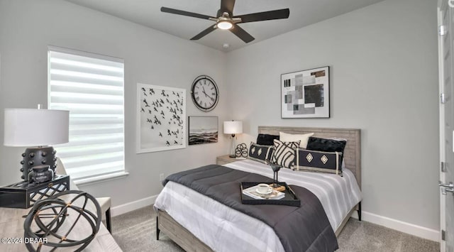 bedroom featuring ceiling fan and light colored carpet