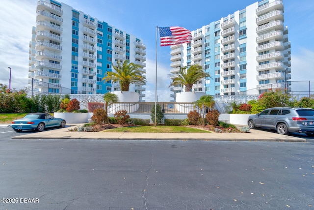 view of property featuring uncovered parking