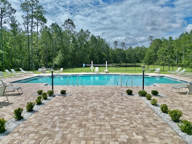 24 Shear Water Trl, Ormond Beach, FL 32174 - community pool with a patio and view of scattered trees