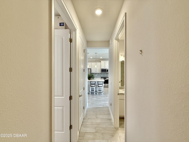 24 Shear Water Trl, Ormond Beach, FL 32174 - hall featuring a textured wall and recessed lighting