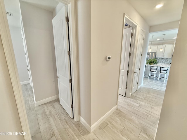 24 Shear Water Trl, Ormond Beach, FL 32174 - hallway featuring light wood-style floors, recessed lighting, and baseboards
