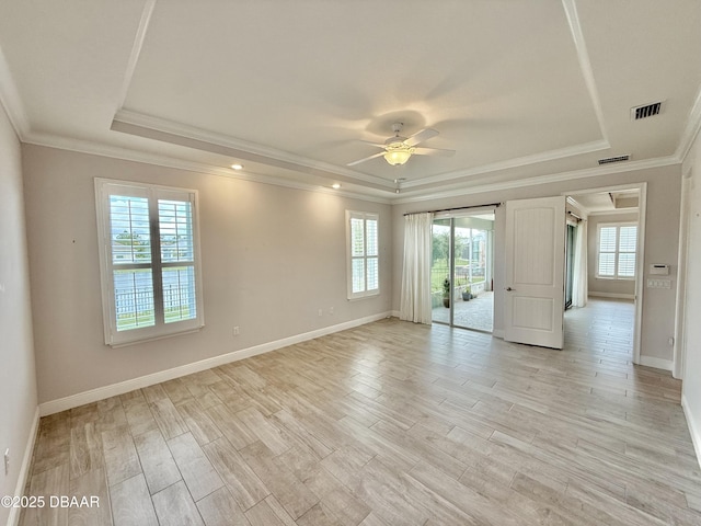 24 Shear Water Trl, Ormond Beach, FL 32174 - unfurnished room with a tray ceiling, ceiling fan, light wood-style flooring, baseboards, and crown molding