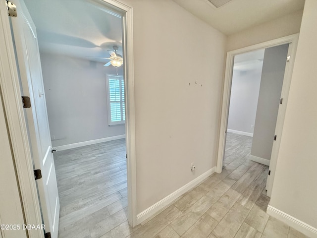 24 Shear Water Trl, Ormond Beach, FL 32174 - hallway with light wood-style floors and baseboards