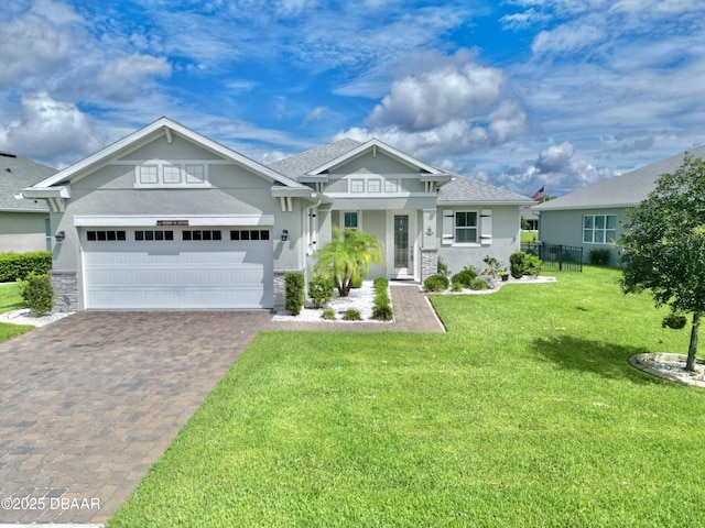 24 Shear Water Trl, Ormond Beach, FL 32174 - craftsman-style house featuring stucco siding, driveway, a garage, and a shingled roof