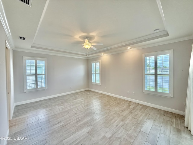 24 Shear Water Trl, Ormond Beach, FL 32174 - unfurnished room featuring a raised ceiling, ornamental molding, a ceiling fan, light wood-style flooring, and baseboards