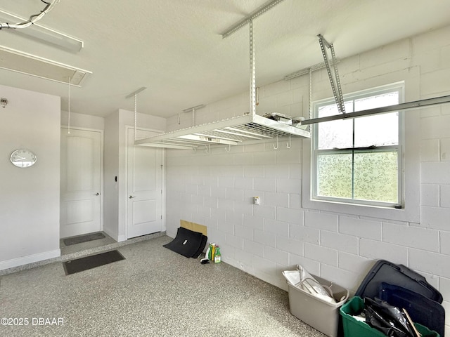 24 Shear Water Trl, Ormond Beach, FL 32174 - garage with concrete block wall and baseboards