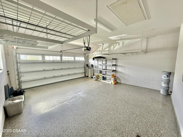 24 Shear Water Trl, Ormond Beach, FL 32174 - garage featuring concrete block wall and a garage door opener