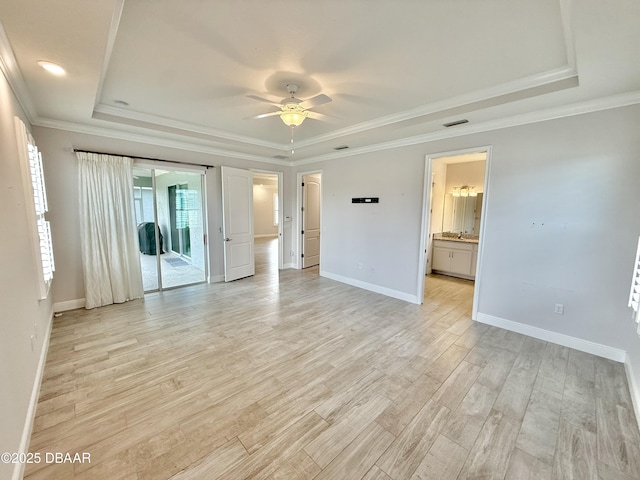 24 Shear Water Trl, Ormond Beach, FL 32174 - unfurnished room with a raised ceiling, baseboards, light wood-style flooring, ornamental molding, and recessed lighting