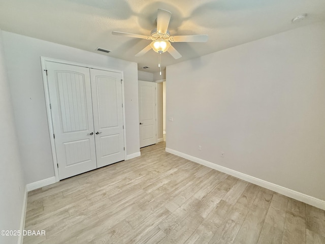 24 Shear Water Trl, Ormond Beach, FL 32174 - unfurnished bedroom featuring baseboards, light wood-style floors, a closet, and ceiling fan