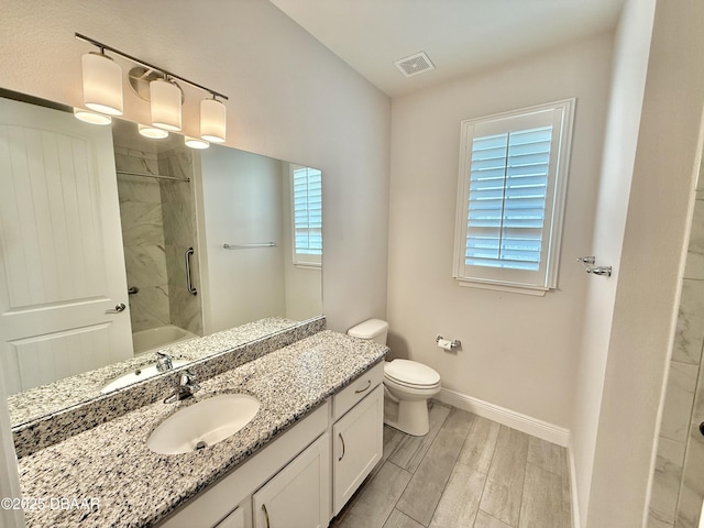 24 Shear Water Trl, Ormond Beach, FL 32174 - bathroom featuring vanity, toilet, baseboards, shower / washtub combination, and wood finished floors