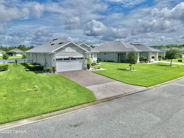24 Shear Water Trl, Ormond Beach, FL 32174 - view of front of house featuring an attached garage, driveway, stucco siding, and a residential view